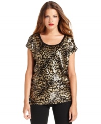 MICHAEL Michael Kors delivers a double dose of shine with this top, featuring a metallic animal print and sequins throughout. MICHAEL Michael Kors delivers a double dose of shine with this top, featuring a metallic animal print and sequins throughout.