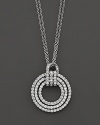 Diamond circle pendant in white gold with link chain.