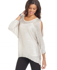 ECI's sweater features a dazzling drape and sparkling shimmer thanks to a sprinkling of sequins. The high-low hem gives the look a super modern feel. ECI's sweater features a dazzling drape and sparkling shimmer thanks to a sprinkling of sequins. The high-low hem gives the look a super modern feel.