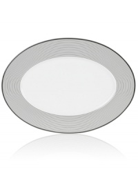 Have fun with the graphic rings and serious durability of Mikasa's Cheers oval platter. Bone china in black and white caters modern tables with a sense of whimsy. (Clearance)