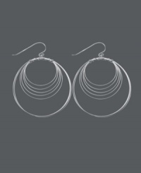 Get style that's out of this orbit! Chic, circular earrings by Unwritten feature a wire wrap design crafted in sterling silver. Approximate drop: 2-1/4 inches.