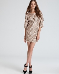 Shimmer in sequins with this dazzling Rachel Zoe dress flaunting fashionable dolman sleeves and a cropped length. Shimmer in sequins with this dazzling Rachel Zoe dress flaunting fashionable dolman sleeves and a cropped length.