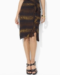 Soft earth tones and breezy cascading ruffles imbue a sarong-inspired silk georgette skirt with bohemian romance. Soft earth tones and breezy cascading ruffles imbue a sarong-inspired silk georgette skirt with bohemian romance.