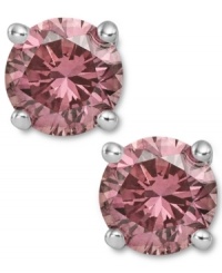 Perfection in pink. These sparkling stud earrings feature round-cut pink diamonds (2 ct. t.w.) in a four-prong setting of 14k white gold. Approximate diameter: 1/3 inch. Perfection in pink. These sparkling stud earrings feature round-cut pink diamonds (2 ct. t.w.) in a four-prong setting of 14k white gold. Approximate diameter: 1/3 inch.