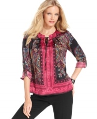 NY Collection's satiny petite peasant top features an alluring mix of prints.