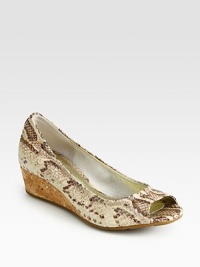Divine snake print adds dimension to this leather wedge with high-tech cushioning and a natural cork wedge. Cork wedge, 1 (25mm)Snake-print leather upperLeather liningRubber solePadded insoleImported Divine snake print adds dimension to this leather wedge with high-tech cushioning and a natural cork wedge. Cork wedge, 1 (25mm)Snake-print leather upperLeather liningRubber solePadded insoleImported