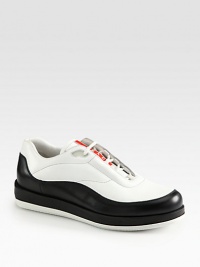 Sleek, sophisticated leather with signature logo detail.Leather upperLeather liningPadded insoleRubber soleMade in Italy Sleek, sophisticated leather with signature logo detail.Leather upperLeather liningPadded insoleRubber soleMade in Italy
