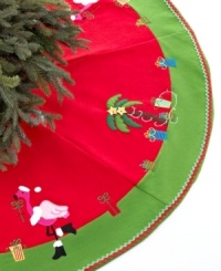 Head south for the winter with a tree skirt trimmed in palms and pink flamingos. Embroidered accents and ribbons of red and green lay the groundwork for a bright and sunny holiday. Head south for the winter with a tree skirt trimmed in palms and pink flamingos. Embroidered accents and ribbons of red and green lay the groundwork for a bright and sunny holiday.
