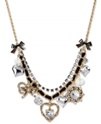 Layer on the loveliness. This frontal necklace from Betsey Johnson boasts hearts and bows accented with glistening crystals. Finished with a black grosgrain ribbon, hematite tone crystal cup chain and bubble hearts. Crafted in antiqued gold tone mixed metal. Approximate length: 16 inches + 3-inch extender. Approximate drop: 1-3/4 inches. Layer on the loveliness. This frontal necklace from Betsey Johnson boasts hearts and bows accented with glistening crystals. Finished with a black grosgrain ribbon, hematite tone crystal cup chain and bubble hearts. Crafted in antiqued gold tone mixed metal. Approximate length: 16 inches + 3-inch extender. Approximate drop: 1-3/4 inches.