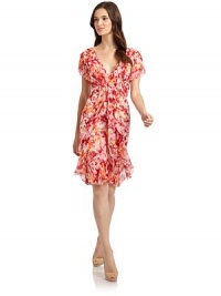 THE LOOKAllover floral printCascading ruffle detail in frontSheer flutter sleevesFront princess seamsV-backTHE FITAbout 36 from shoulder to hemTHE MATERIALSilkCARE & ORIGINDry cleanMade in USAModel shown is 5'11 (180cm) wearing US size 4. THE LOOKAllover floral printCascading ruffle detail in frontSheer flutter sleevesFront princess seamsV-backTHE FITAbout 36 from shoulder to hemTHE MATERIALSilkCARE & ORIGINDry cleanMade in USAModel shown is 5'11 (180cm) wearing US size 4.