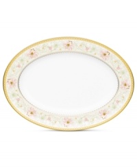 East meets West in the ornate Blooming Splendor oval platter by Noritake. A Japanese-inspired pattern with raised dots encircles intricate florals rooted in white bone china.