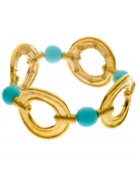 Make a splash year round! T Tahari's chic stretch bracelet highlights cut-out circles and resin beads in turquoise hues. Crafted in antique gold tone mixed metal. Bracelet stretches to fit wrist. Approximate diameter: 2-1/4 inches. Make a splash year round! T Tahari's chic stretch bracelet highlights cut-out circles and resin beads in turquoise hues. Crafted in antique gold tone mixed metal. Bracelet stretches to fit wrist. Approximate diameter: 2-1/4 inches.