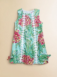 Vibrant florals on pure cotton, accented with lace and bow accents. JewelneckSleevelessTwo bands of lace down the center frontSide bows on the hemBack zipperCottonFully linedMachine washImported Vibrant florals on pure cotton, accented with lace and bow accents. JewelneckSleevelessTwo bands of lace down the center frontSide bows on the hemBack zipperCottonFully linedMachine washImported