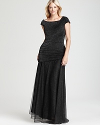 With a subtle, understated sparkle, Tadashi Shoji's dazzling dress lends a brilliant look to the evening's events. With a subtle, understated sparkle, Tadashi Shoji's dazzling dress lends a brilliant look to the evening's events.