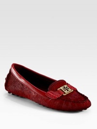 A comfortable logo staple made of lush calf hair with smooth leather trim. Calf hair upper with leather trimLeather liningRubber solePadded insoleImported A comfortable logo staple made of lush calf hair with smooth leather trim. Calf hair upper with leather trimLeather liningRubber solePadded insoleImported