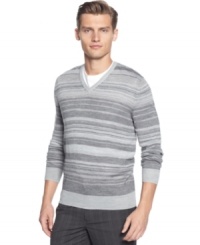 Layer me over a t-shirt and you'll create a relax pull together look with this striped merino v-neck sweater by Calvin Klein. Layer me over a t-shirt and you'll create a relax pull together look with this striped merino v-neck sweater by Calvin Klein.