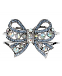 The finishing touch for the perfect outfit! Betsey Johnson's adorable ribbon bow bracelet features a two-row hinge bangle, crafted in rhodium-plated mixed metal with blue and clear crystal accents. Approximate diameter: 8 inches. The finishing touch for the perfect outfit! Betsey Johnson's adorable ribbon bow bracelet features a two-row hinge bangle, crafted in rhodium-plated mixed metal with blue and clear crystal accents. Approximate diameter: 8 inches.