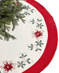 Festive from the ground up. Ribbon poinsettia blossoms stitched in Jabara's red and white tree skirt complement your Christmas tree with crafted elegance. Festive from the ground up. Ribbon poinsettia blossoms stitched in Jabara's red and white tree skirt complement your Christmas tree with crafted elegance.