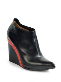 THE LOOKPoint toeConcealed elastic goring on the sideNotched back wedge detailPadded insoleStacked colorblock wedge, 4 (100mm)THE MATERIALLeather upperLeather lining and soleORIGINMade in Italy THE LOOKPoint toeConcealed elastic goring on the sideNotched back wedge detailPadded insoleStacked colorblock wedge, 4 (100mm)THE MATERIALLeather upperLeather lining and soleORIGINMade in Italy