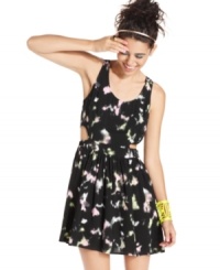 Flirty side cutouts and clouds of color make this a-line dress from Material Girl an adorable style for a shopping date with your bestie! Flirty side cutouts and clouds of color make this a-line dress from Material Girl an adorable style for a shopping date with your bestie!