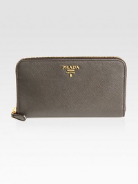 Timeless style in calfskin leather with a zip around closure.Zipper closure Gold-plated hardware Metal lettering logo Center coin compartment Zipper and bill compartment Eight credit card slots Calfskin leather lining 7½W X 4H X ¾D Made in Italy Timeless style in calfskin leather with a zip around closure.Zipper closure Gold-plated hardware Metal lettering logo Center coin compartment Zipper and bill compartment Eight credit card slots Calfskin leather lining 7½W X 4H X ¾D Made in Italy