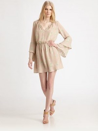 Delicate lilies play on airy silk in this comely blouson frock tailored with pretty bell sleeves.Split V necklineBell sleevesTiered cuffsBlouson bodiceFlared hemAbout 34 from shoulder to hemSilkDry cleanImportedModel shown is 5'10 (177cm) wearing US size Small. Delicate lilies play on airy silk in this comely blouson frock tailored with pretty bell sleeves.Split V necklineBell sleevesTiered cuffsBlouson bodiceFlared hemAbout 34 from shoulder to hemSilkDry cleanImportedModel shown is 5'10 (177cm) wearing US size Small.