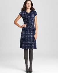 A study in classic feminine style, this Tory Burch dress flaunts a charming plaid print and a delicately ruffled front for effortless polish. Just add a dash of pearls and prepare to head the fashion class. A study in classic feminine style, this Tory Burch dress flaunts a charming plaid print and a delicately ruffled front for effortless polish. Just add a dash of pearls and prepare to head the fashion class.