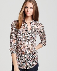 Right on course for fall with an on-trend leopard print, this multi-colored BCBGMAXAZRIA blouse offers an exotic touch of sheer elegance with trousers, pencil skirts and leather minis. Right on course for fall with an on-trend leopard print, this multi-colored BCBGMAXAZRIA blouse offers an exotic touch of sheer elegance with trousers, pencil skirts and leather minis.