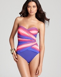 Monet-inspired watercolors make a splash poolside in this Gottex surplice halter swimsuit. The goddess-worthy draping is both chic and incredibly figure flattering. Monet-inspired watercolors make a splash poolside in this Gottex surplice halter swimsuit. The goddess-worthy draping is both chic and incredibly figure flattering.