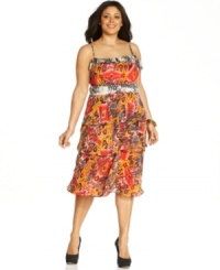 A vibrant print and flattering tiered silhouette makes this Nine West plus size dress an incomparable pick for the seasonal celebrations ahead! A vibrant print and flattering tiered silhouette makes this Nine West plus size dress an incomparable pick for the seasonal celebrations ahead!