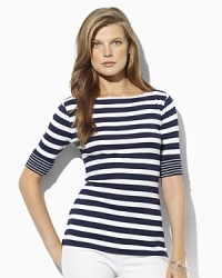 A chic boat neckline lends the ultra-soft cotton shirt, finished with elbow-length sleeves and rolled cuffs, modern, casual appeal. A chic boat neckline lends the ultra-soft cotton shirt, finished with elbow-length sleeves and rolled cuffs, modern, casual appeal.