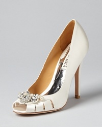 These stately pumps from evening style specialist Badgley Mischka hit all the right notes, with jeweled vamps, peep toes and elegant cut-out details. These stately pumps from evening style specialist Badgley Mischka hit all the right notes, with jeweled vamps, peep toes and elegant cut-out details.
