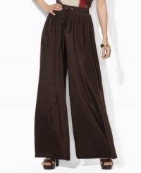 Lauren by Ralph Lauren's petite wide-leg pants are crafted with a soft sueded crepe construction and finished with a comfortable smocked waistband for ease and style. Lauren by Ralph Lauren's petite wide-leg pants are crafted with a soft sueded crepe construction and finished with a comfortable smocked waistband for ease and style.