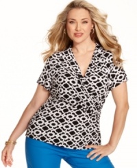 A draped crossover front lends a slenderizing silhouette to Charter Club's short sleeve plus size top, spotlighting a graphic print. A draped crossover front lends a slenderizing silhouette to Charter Club's short sleeve plus size top, spotlighting a graphic print.