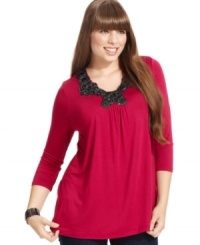 Dress up your casual style with ING's three-quarter-sleeve plus size top, accented by an embellished neckline. Dress up your casual style with ING's three-quarter-sleeve plus size top, accented by an embellished neckline.