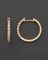 Diamonds set in 14K. yellow gold hoops. Diamonds set in 14K. yellow gold hoops.