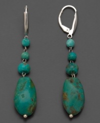 Go for a progressive look. These gorgeous earrings feature off-shape baroque turquoise set in sterling silver. Approximate drop: 2 inches. Go for a progressive look. These gorgeous earrings feature off-shape baroque turquoise set in sterling silver. Approximate drop: 2 inches.