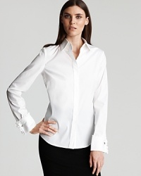 Elie Tahari lends timeless perfection to workday wares in this crisp white blouse. Pair with everything from high-waisted skirts to sleek trousers for a classy finish. Elie Tahari lends timeless perfection to workday wares in this crisp white blouse. Pair with everything from high-waisted skirts to sleek trousers for a classy finish.