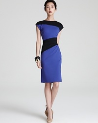 Asymmetrical color-blocking lends figure-flattering style to this ruched Escada jersey dress. Asymmetrical color-blocking lends figure-flattering style to this ruched Escada jersey dress.
