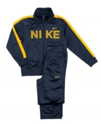 Get him ready to run with the big boys in this sporty jacket and pants set from Nike. Get him ready to run with the big boys in this sporty jacket and pants set from Nike.