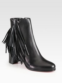 Channel 70's-era vibes wearing this leather ankle boot with playful fringe and a convenient side zip. Stacked heel, 2¾ (70mm)Leather upperSide zipLeather liningSignature red leather solePadded insoleMade in Italy Channel 70's-era vibes wearing this leather ankle boot with playful fringe and a convenient side zip. Stacked heel, 2¾ (70mm)Leather upperSide zipLeather liningSignature red leather solePadded insoleMade in Italy