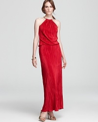 In a brilliant scarlet hue, Laundry by Shelli Segal's ring-neck gown shows off allover micro pleating on a silhouette that's perfectly accessorized with an armful of golden bangles. In a brilliant scarlet hue, Laundry by Shelli Segal's ring-neck gown shows off allover micro pleating on a silhouette that's perfectly accessorized with an armful of golden bangles.
