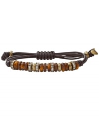 Neutralize your look. Subtle semi-precious tiger's eye and clear crystal beads decorate Fossil's trendy brown leather wrap bracelet. Set in brass tone mixed metal. Bracelet adjusts to fit wrist. Approximate diameter: 2-1/2 inches. Neutralize your look. Subtle semi-precious tiger's eye and clear crystal beads decorate Fossil's trendy brown leather wrap bracelet. Set in brass tone mixed metal. Bracelet adjusts to fit wrist. Approximate diameter: 2-1/2 inches.