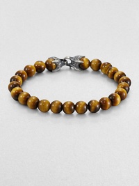 A natural look is a fabulous match for any ensemble, laced with smooth tiger's eye beads.Silver chevron clasp8 mm beadsAbout 8½ longImported