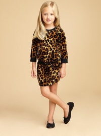 A bold leopard print adds a flash of brilliance to this three-quarter sleeve velour frock with drawstring waistband and slash pockets.CrewneckThree-quarter raglan sleevesPullover styleElastic & drawstring waistbandFront slash pocketCotton/PolyesterMachine washImported A bold leopard print adds a flash of brilliance to this three-quarter sleeve velour frock with drawstring waistband and slash pockets.CrewneckThree-quarter raglan sleevesPullover styleElastic & drawstring waistbandFront slash pocketCotton/PolyesterMachine washImported