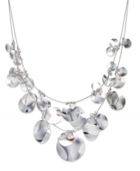 Put your chips on the table with this illusion necklace from Sequin. Two rows string shimmering pendants in a rounded design. Crafted in silver tone mixed metal. Approximate length: 17 inches + 3-inch extender. Put your chips on the table with this illusion necklace from Sequin. Two rows string shimmering pendants in a rounded design. Crafted in silver tone mixed metal. Approximate length: 17 inches + 3-inch extender.