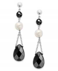 Ebony and ivory. Cultured freshwater pearls (6-1/2-7 mm) and faceted onyx (9 mm x 13 mm and 5 mm) create an elegant look on these dangling sterling silver earrings. Approximate drop: 1-3/4 inches. Ebony and ivory. Cultured freshwater pearls (6-1/2-7 mm) and faceted onyx (9 mm x 13 mm and 5 mm) create an elegant look on these dangling sterling silver earrings. Approximate drop: 1-3/4 inches.