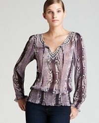 Send your style on an exotic spin with this Shiloh 770 blouse alive with sleek snakeskin print. Sequin embellishment accentuates the tonal palette for a glamorous walk on the wild side. Send your style on an exotic spin with this Shiloh 770 blouse alive with sleek snakeskin print. Sequin embellishment accentuates the tonal palette for a glamorous walk on the wild side.