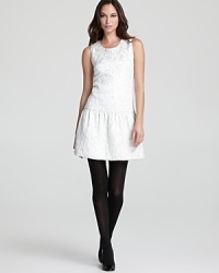 Lend chic luster to your everyday look in this DKNY dress illuminated by a vintage jacquard print. A drop waist and flared skirt take the style to new levels of luxe. Lend chic luster to your everyday look in this DKNY dress illuminated by a vintage jacquard print. A drop waist and flared skirt take the style to new levels of luxe.