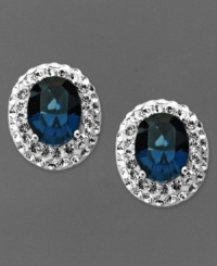 Startling baby blues. Oval-shaped blue crystals adorn Kaleidsocope's knock out stud earrings. Crafted in sterling silver with Swarovski Elements. Approximate drop length: 6/8 inch. Approximate drop width: 1/2 inch.